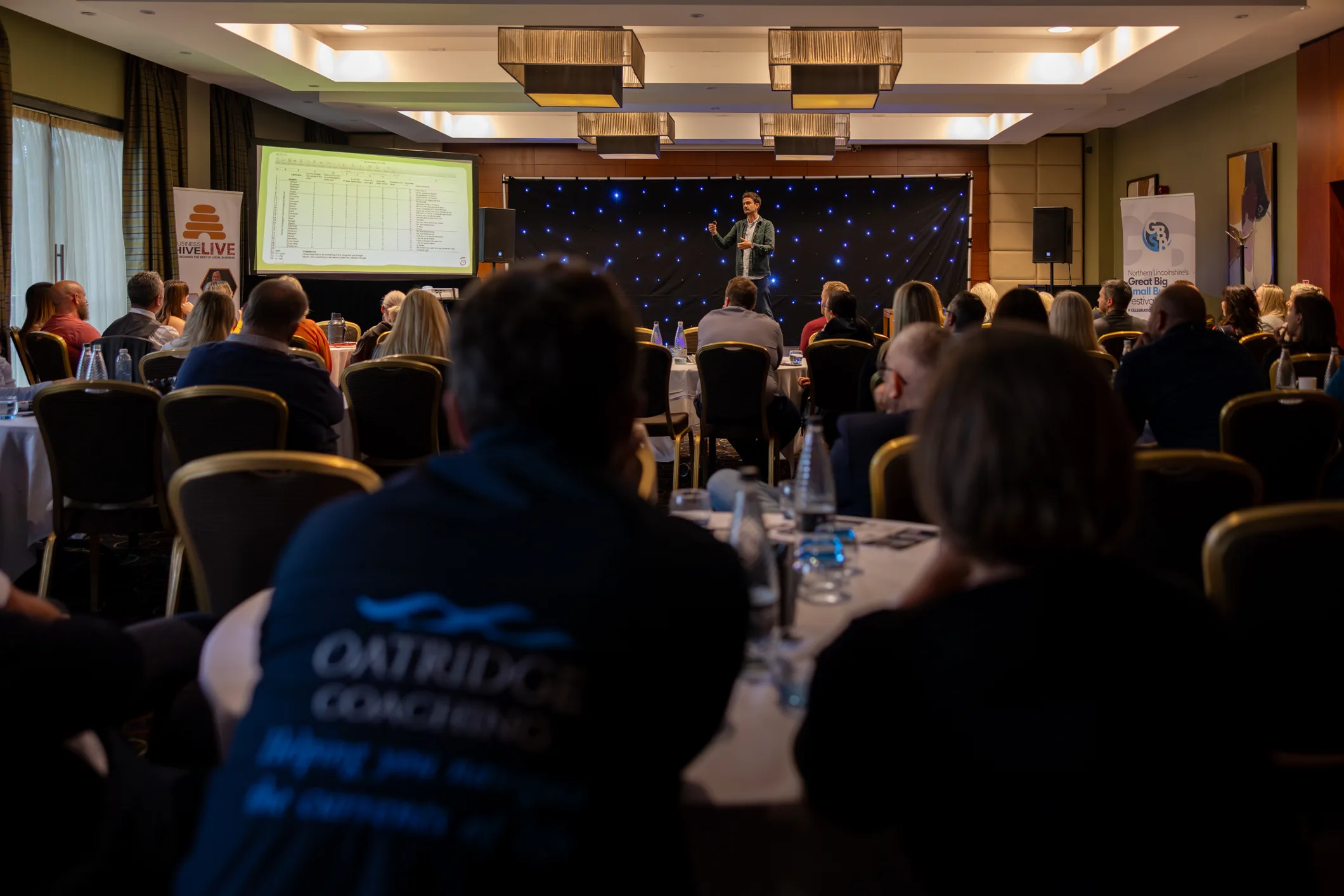 Audience watching a live event presentation