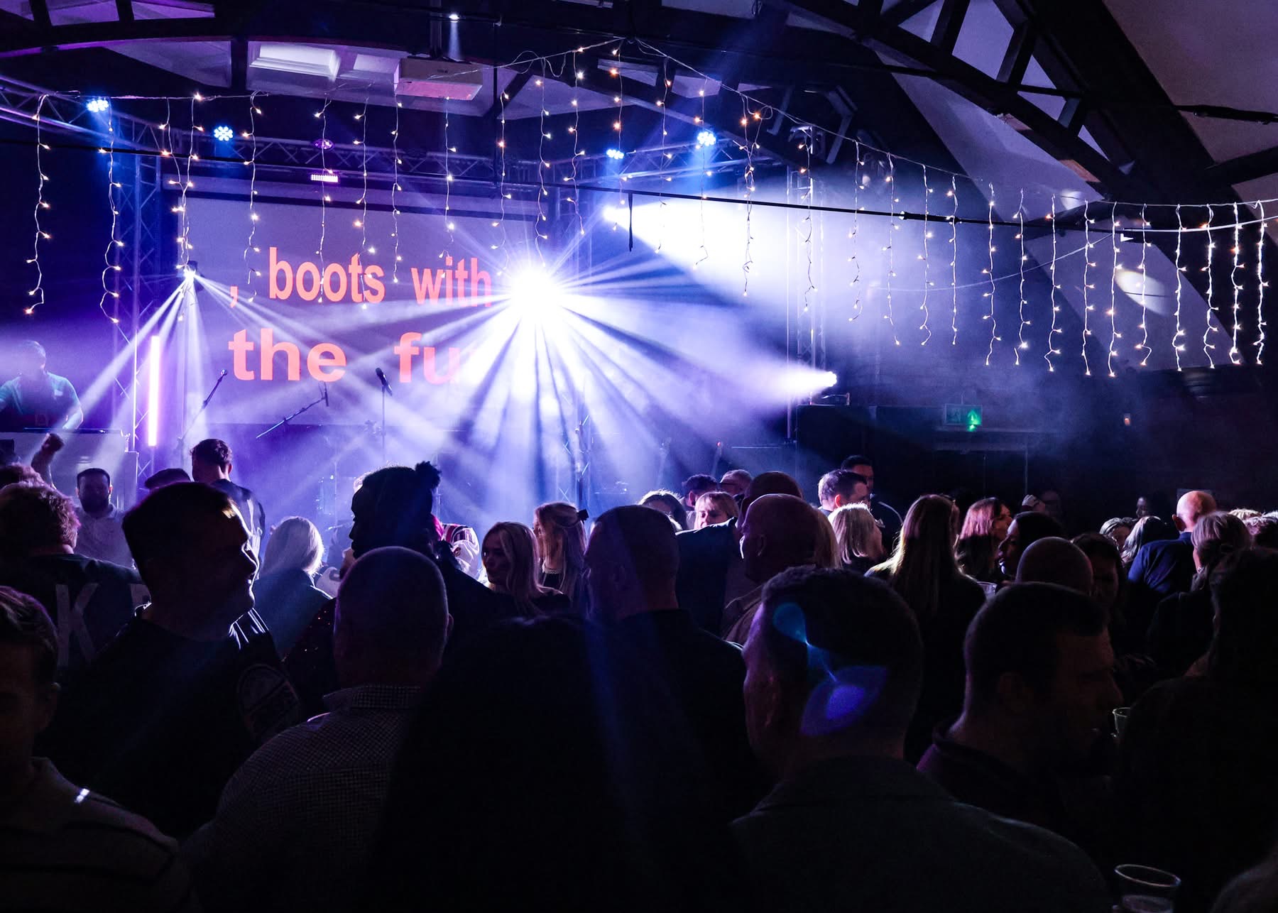 Large crowd enjoying a live event hosted by DJ Steve Rusling