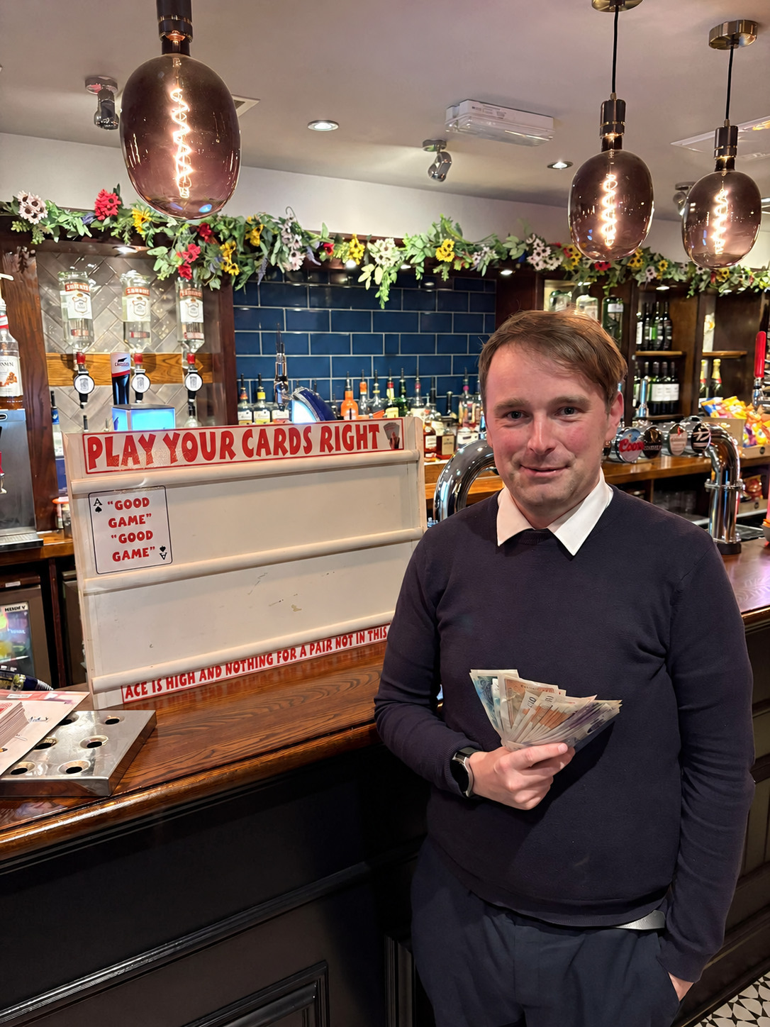 Higher or Lower winner holding over £400 in prize money at a pub game night